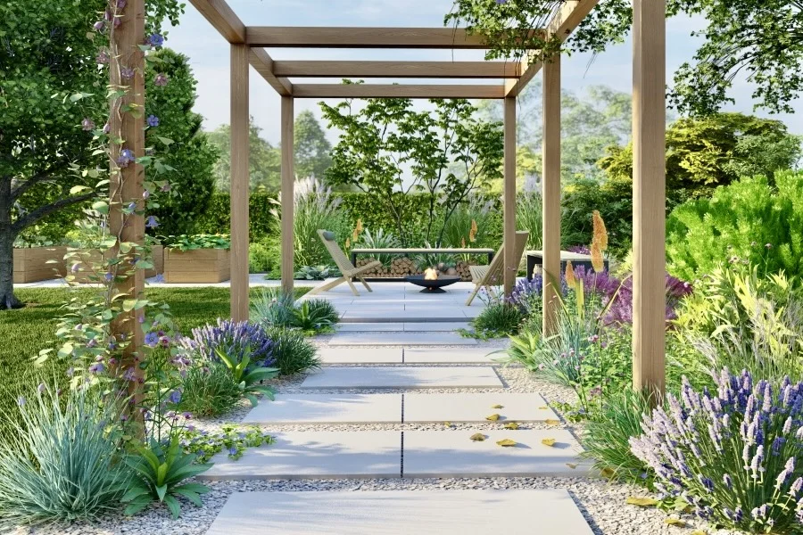 Vue en perspective depuis la pergola sur la terrasse d'agrément à côté du potager surélevé en bois