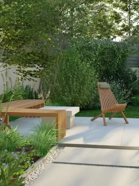 idée d'aménagement pour un jardin contemporain en pente : dalles, chemin de gravier et mobilier moderne